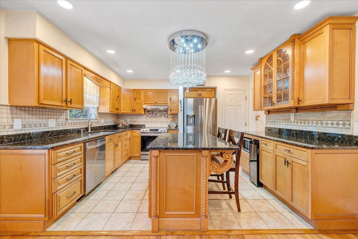4434 Rosecrest Road Roanoke, VA 24018 - Photo 3 of 48 a kitchen with stainless steel appliances granite countertop a stove top oven a sink dishwasher and cabinets with wooden floor