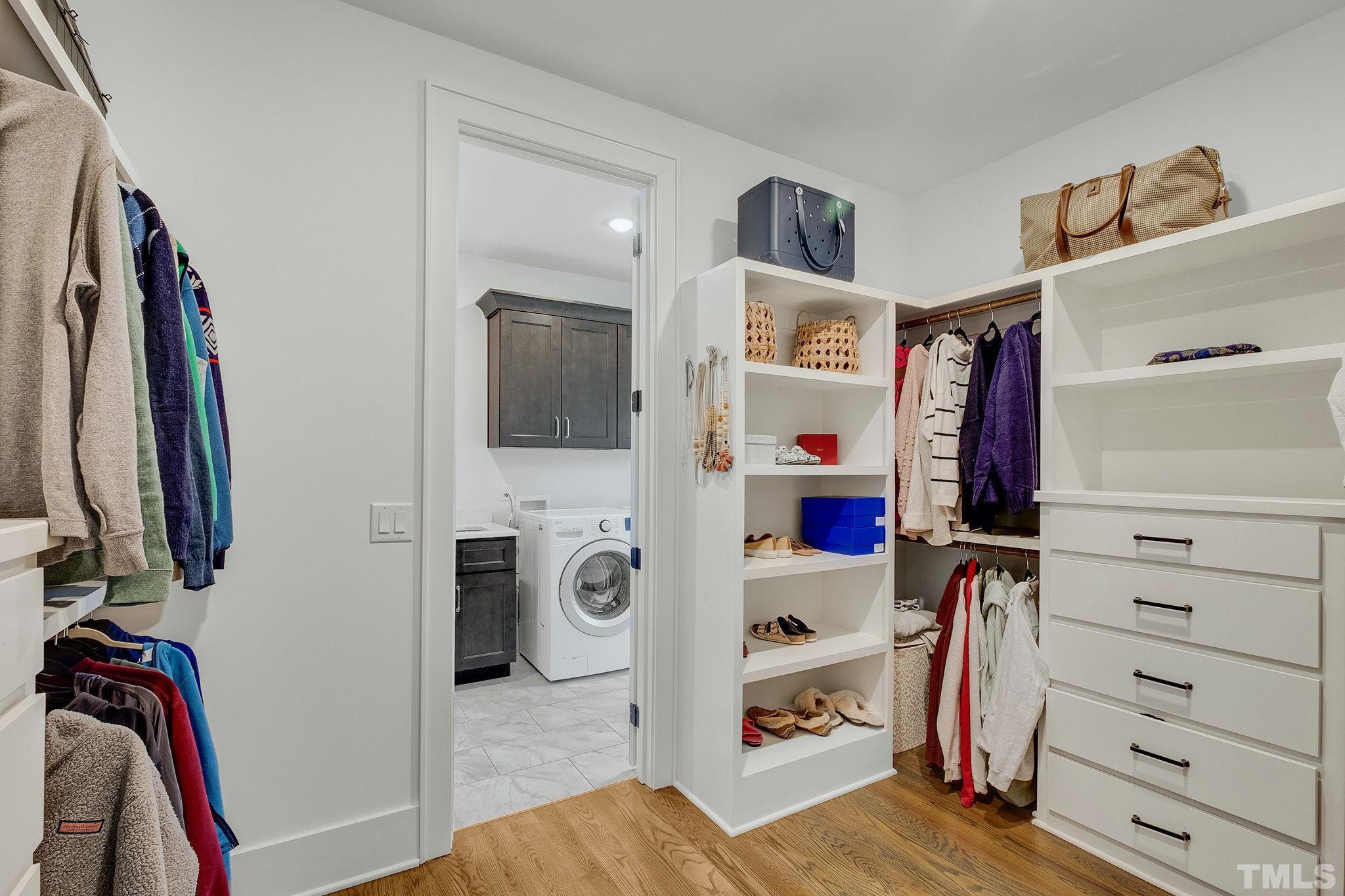 3025 Lewis Farm Road Raleigh, NC 27607 - Photo 23 of 42 a view of walk in closet with clothes and shoes