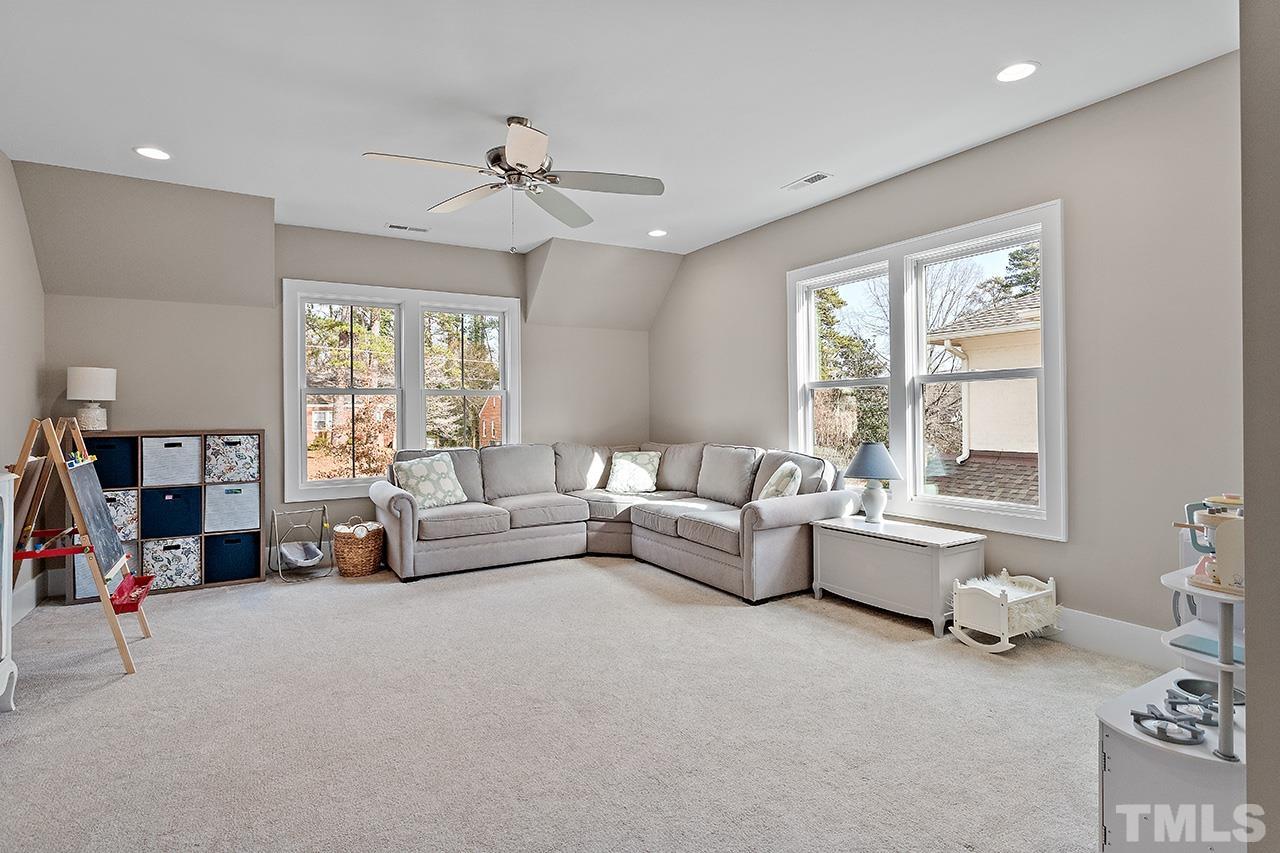 3025 Lewis Farm Road Raleigh, NC 27607 - Photo 33 of 42 a living room with furniture and a large window