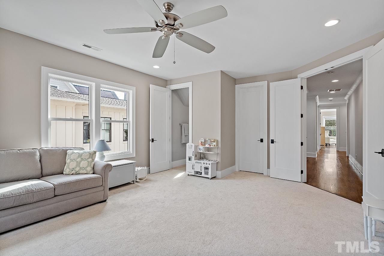 3025 Lewis Farm Road Raleigh, NC 27607 - Photo 34 of 42 a living room with furniture and a large window