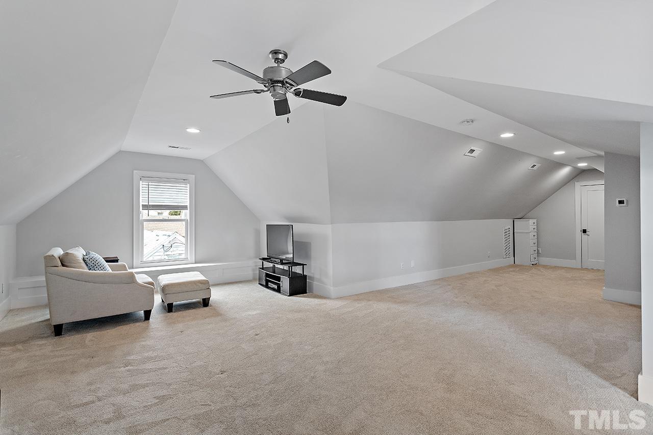 3025 Lewis Farm Road Raleigh, NC 27607 - Photo 37 of 42 a living room with furniture and natural light