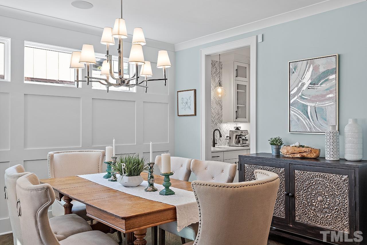 3025 Lewis Farm Road Raleigh, NC 27607 - Photo 5 of 42 a living room with furniture and a chandelier