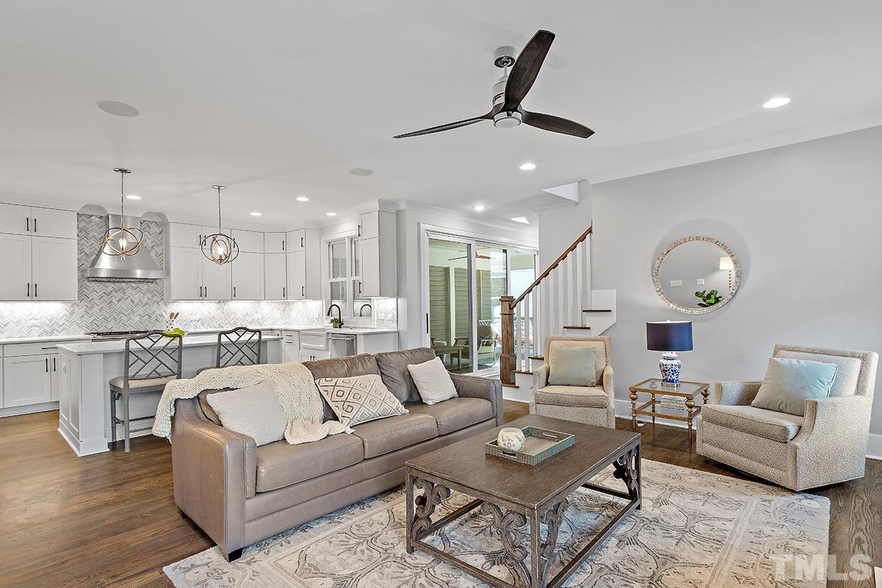 3025 Lewis Farm Road Raleigh, NC 27607 - Photo 10 of 42 a living room with furniture kitchen and a chandelier