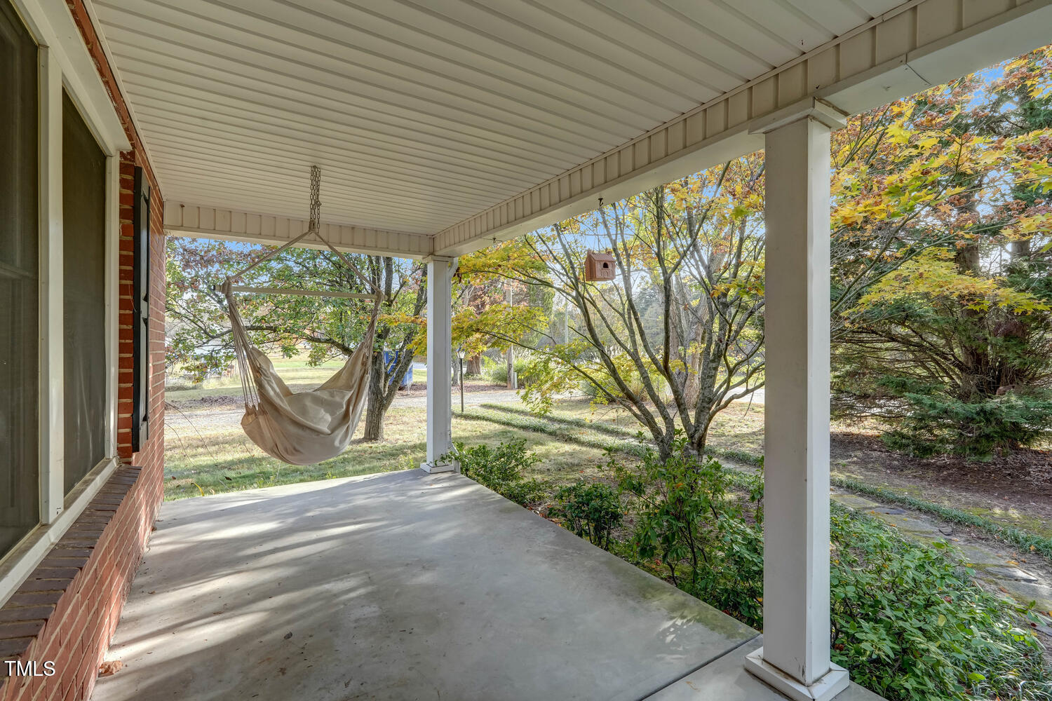 1365 Ashley Loop Reidsville, NC 27320 - Photo 11 of 55 a view of a porch with couches and wooden fence next to a yard