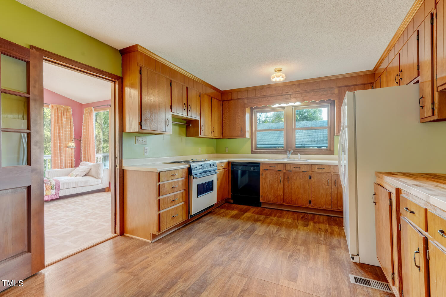 1365 Ashley Loop Reidsville, NC 27320 - Photo 15 of 55 a kitchen with stainless steel appliances granite countertop a stove a sink and a refrigerator