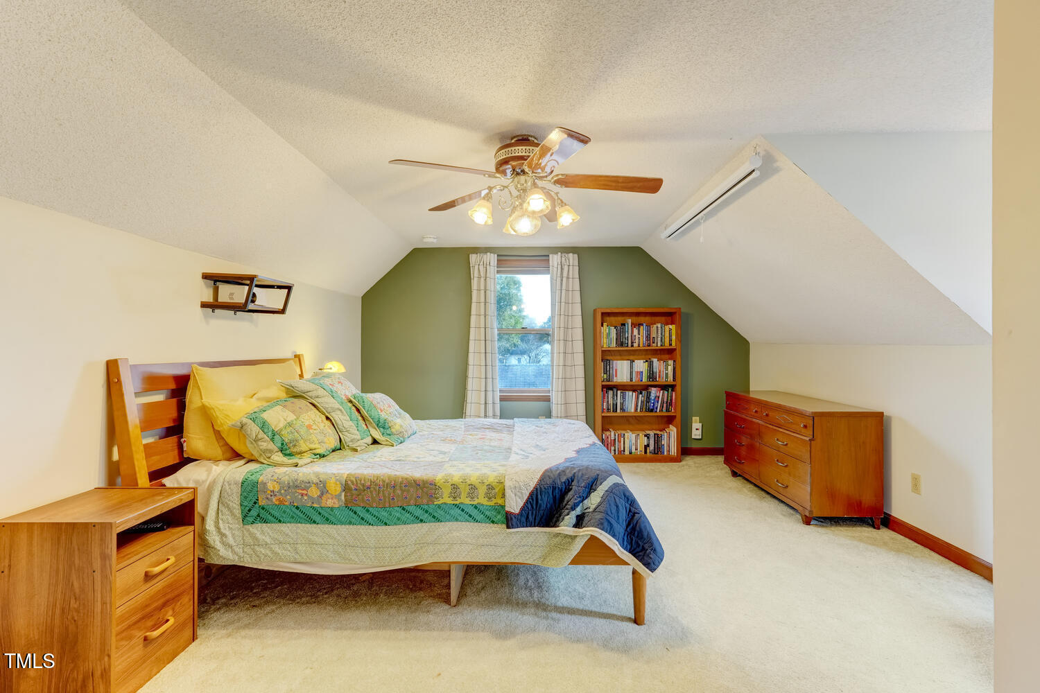 1365 Ashley Loop Reidsville, NC 27320 - Photo 27 of 55 a bedroom with a bed and a chandelier