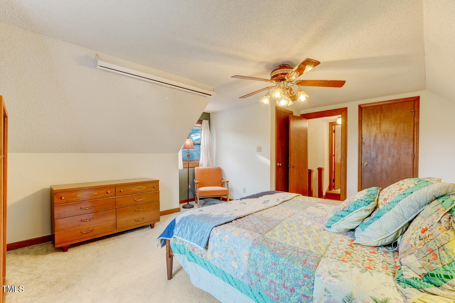 1365 Ashley Loop Reidsville, NC 27320 - Photo 29 of 55 a bedroom with a bed and a chandelier