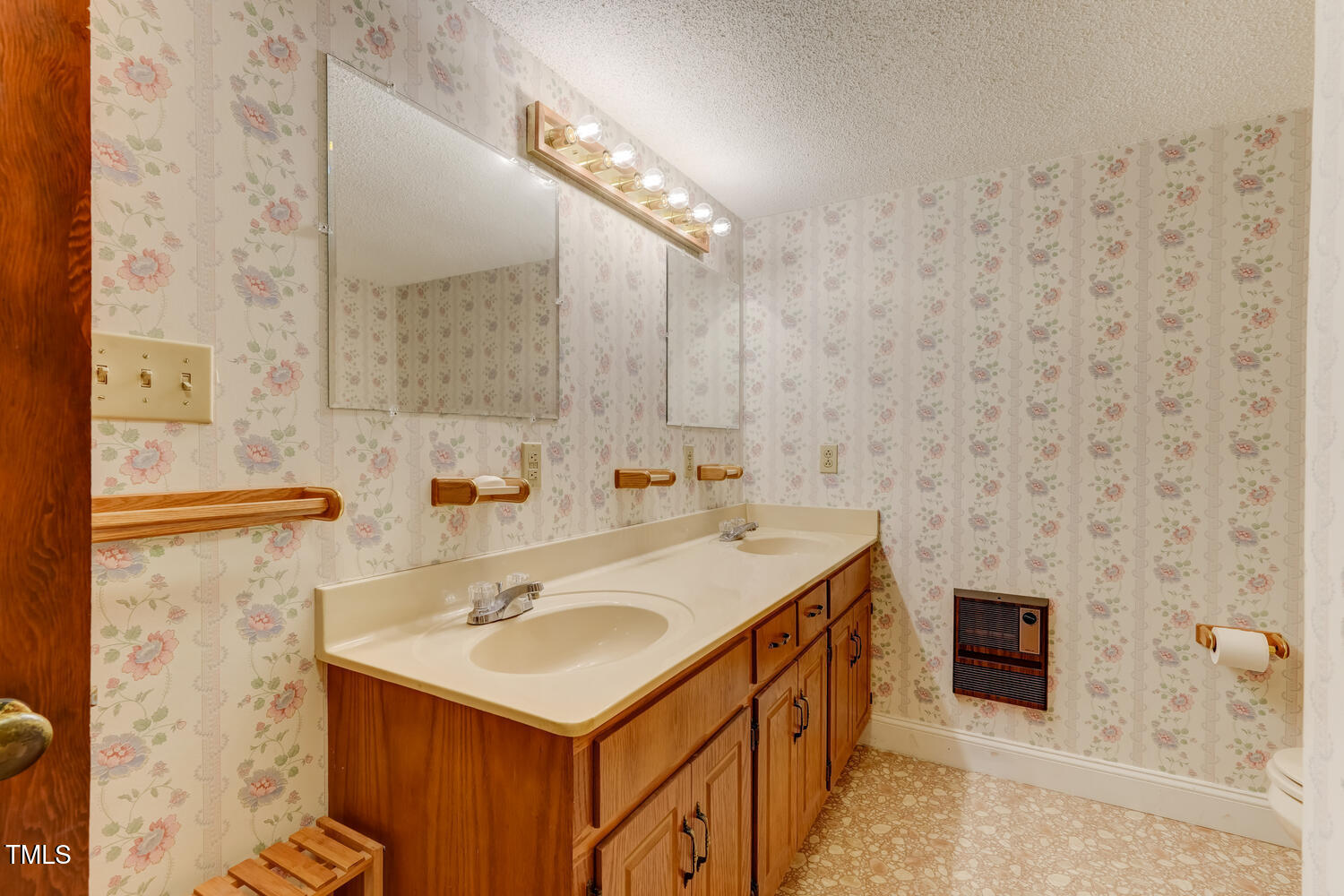 1365 Ashley Loop Reidsville, NC 27320 - Photo 30 of 55 a bathroom with a sink and a mirror