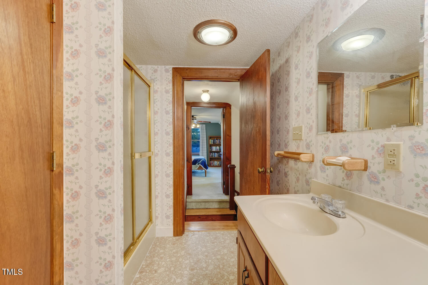 1365 Ashley Loop Reidsville, NC 27320 - Photo 31 of 55 a en suite bathroom with a sink and a mirror