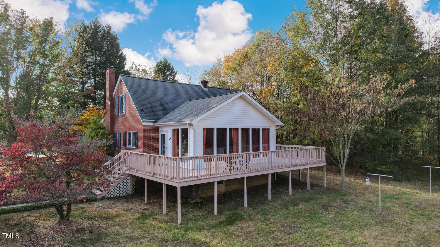 1365 Ashley Loop Reidsville, NC 27320 - Photo 35 of 55 a wooden deck with white house and wooden fence