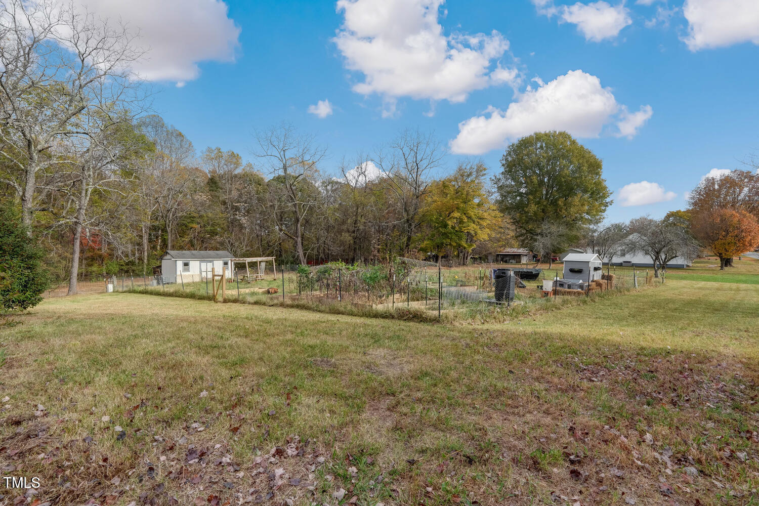 1365 Ashley Loop Reidsville, NC 27320 - Photo 37 of 55 a backyard of a house with table and chairs
