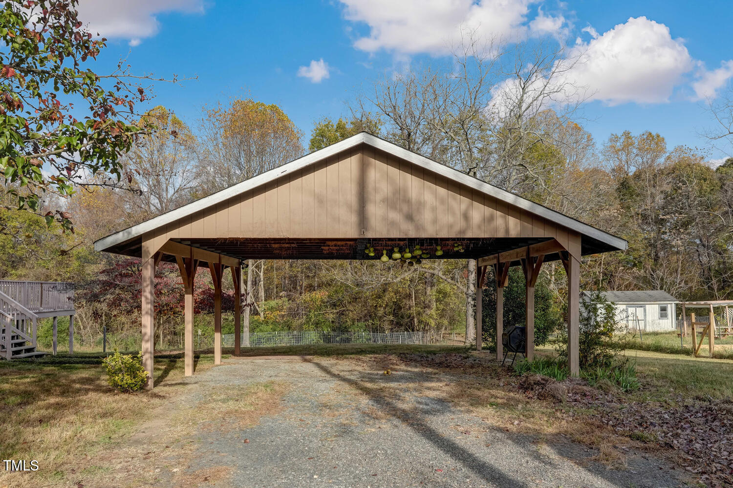 1365 Ashley Loop Reidsville, NC 27320 - Photo 8 of 55 a backyard of a house with table and chairs under an umbrella