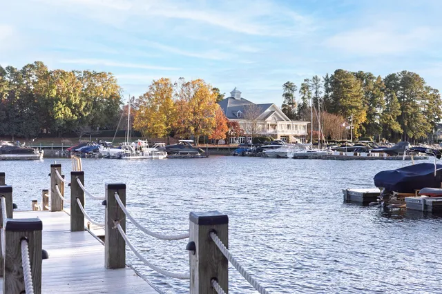 a view of a lake with outdoor seating