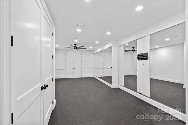 a view of an empty room with a fireplace