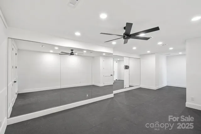 a view of an empty room with a fireplace