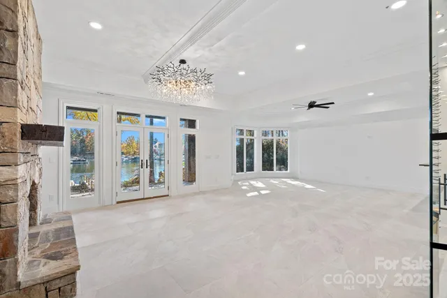 a view of hall with stainless steel appliances kitchen area and entryway