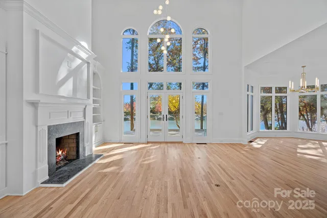 a view of livingroom with fireplace and wooden floor