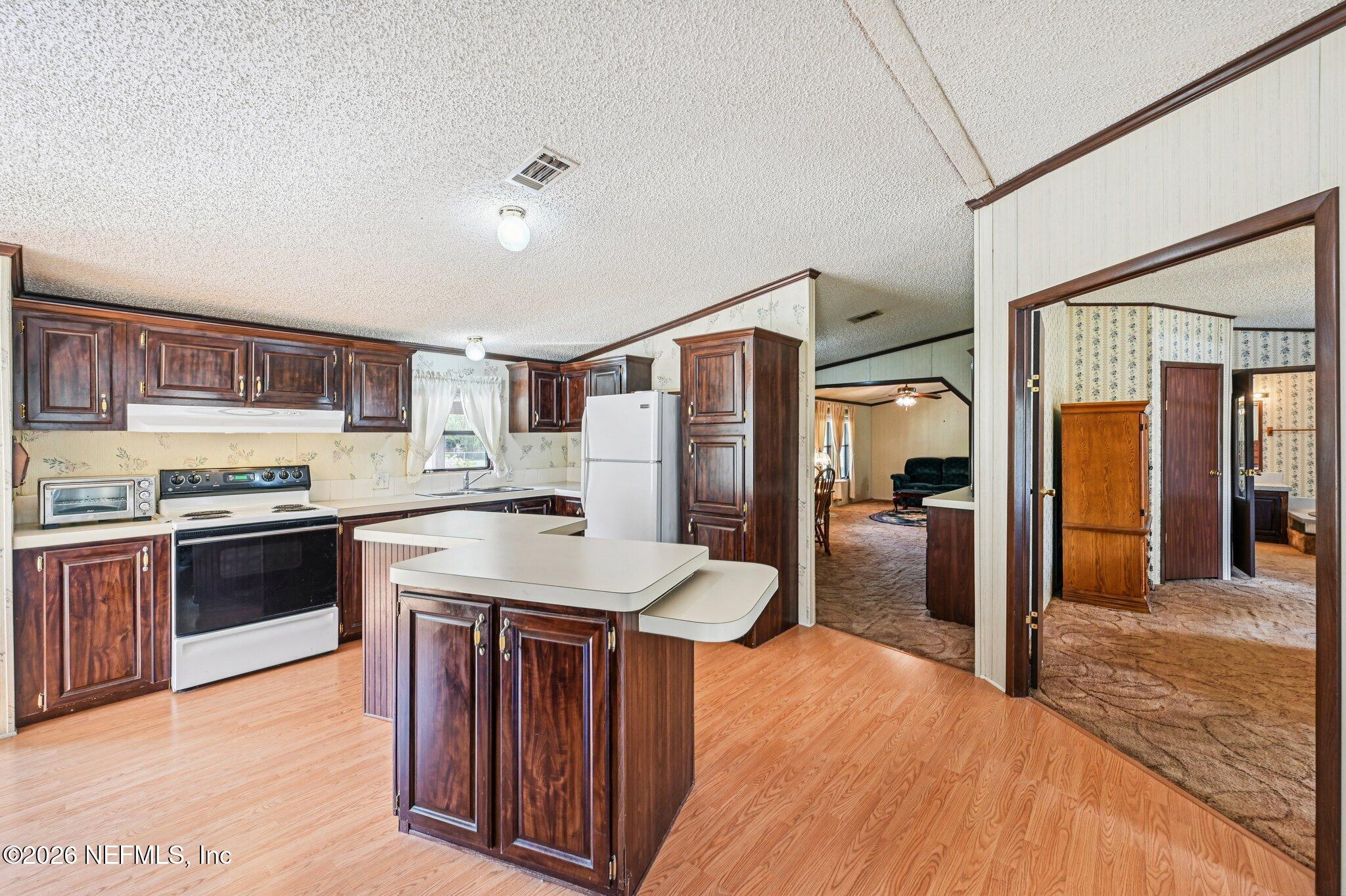 128 Sesame Street Middleburg, FL 32068 - Photo 26 of 66 Large Kitchen with Island