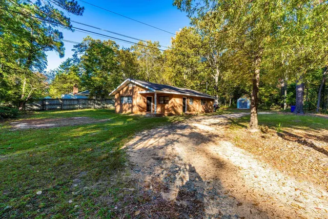 a backyard of a house with lots of green space