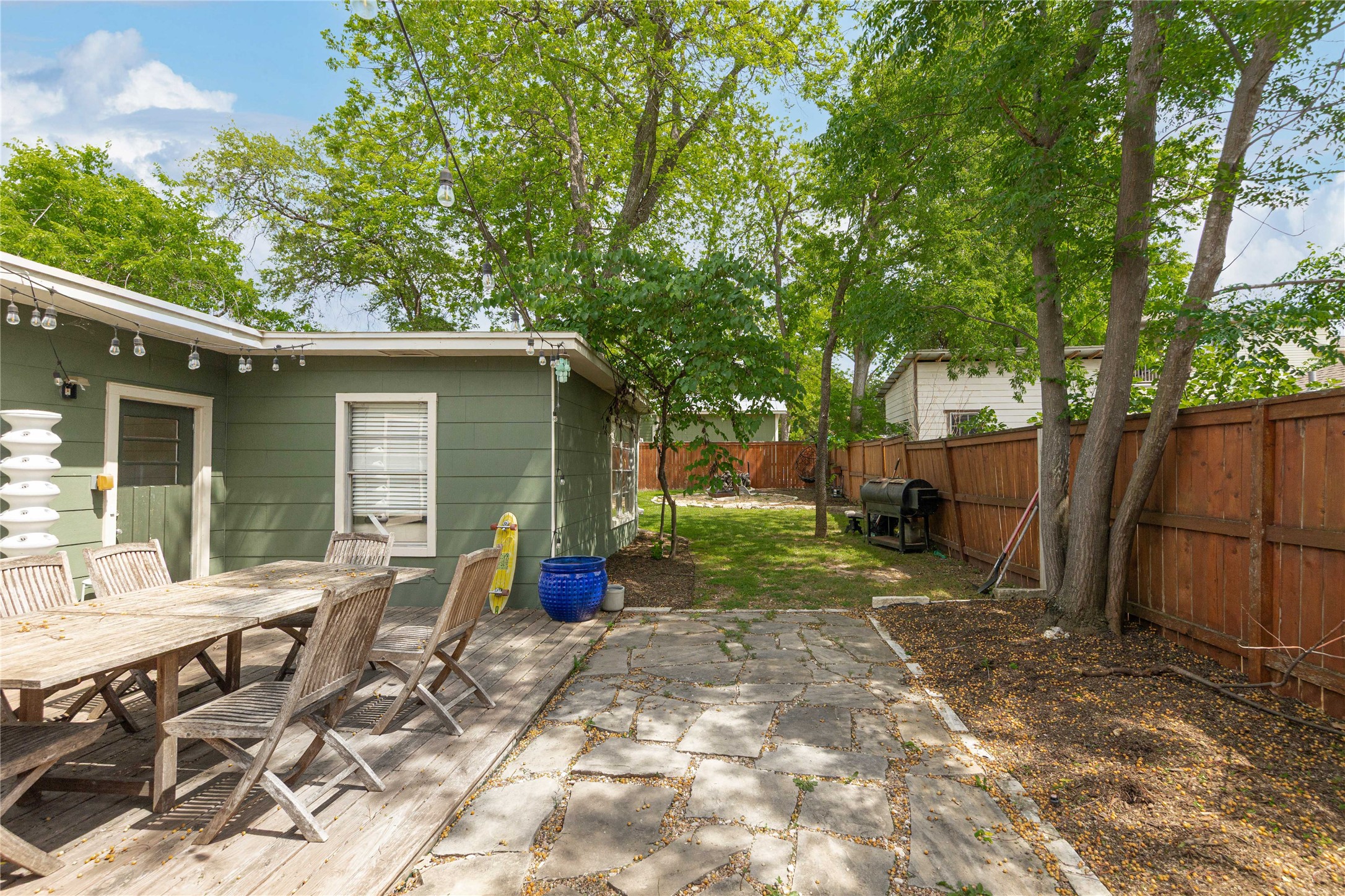 4607 Evans Avenue, Unit B Austin, TX 78751 - Photo 24 of 34 Outdoor living area with a stone patio and an expansive lawn