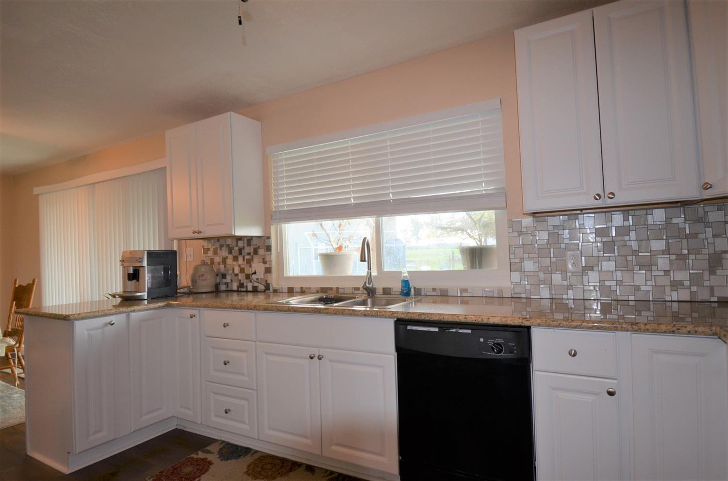 16936 Mark Road Madera, CA 93636 - Photo 17 of 27 New cabinets, new granite counters, new appliances, new lighting, new windows, new blinds.