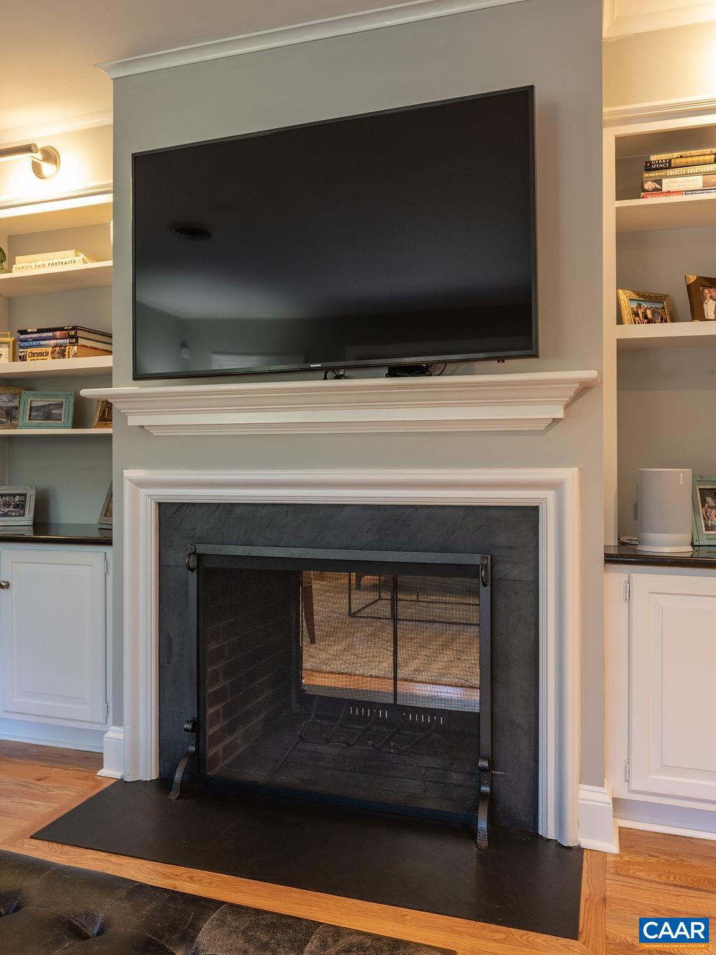 1882 Westview Road Charlottesville, VA 22903 - Photo 12 of 52 a living room with a fireplace and a flat screen tv