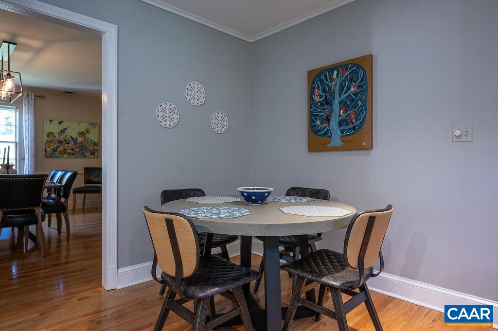1882 Westview Road Charlottesville, VA 22903 - Photo 15 of 52 a view of a dining room with furniture and wooden floor