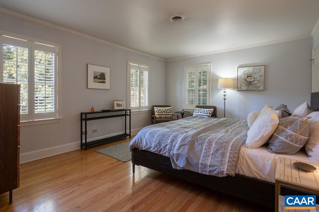 1882 Westview Road Charlottesville, VA 22903 - Photo 19 of 52 a bedroom with a bed and wooden floor