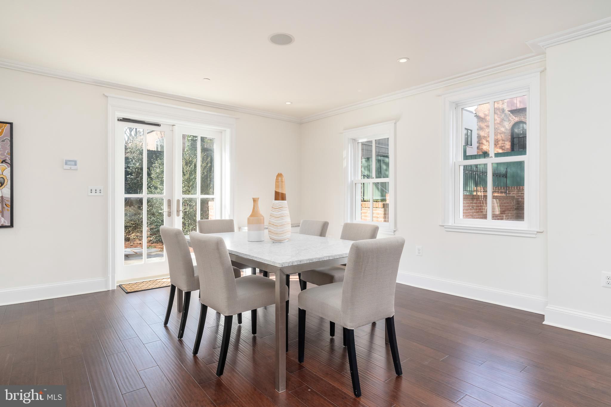 2715 N Street Northwest Washington, DC 20007 - Photo 22 of 41 a view of a dining room with furniture and wooden floor