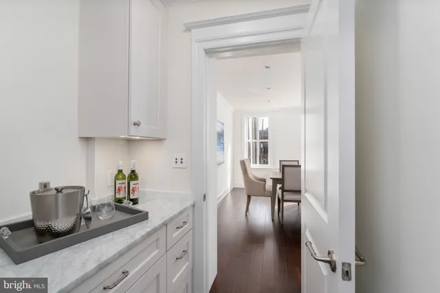 a kitchen with a table and chairs