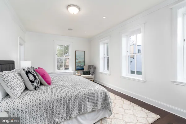 a bedroom with bed and a window
