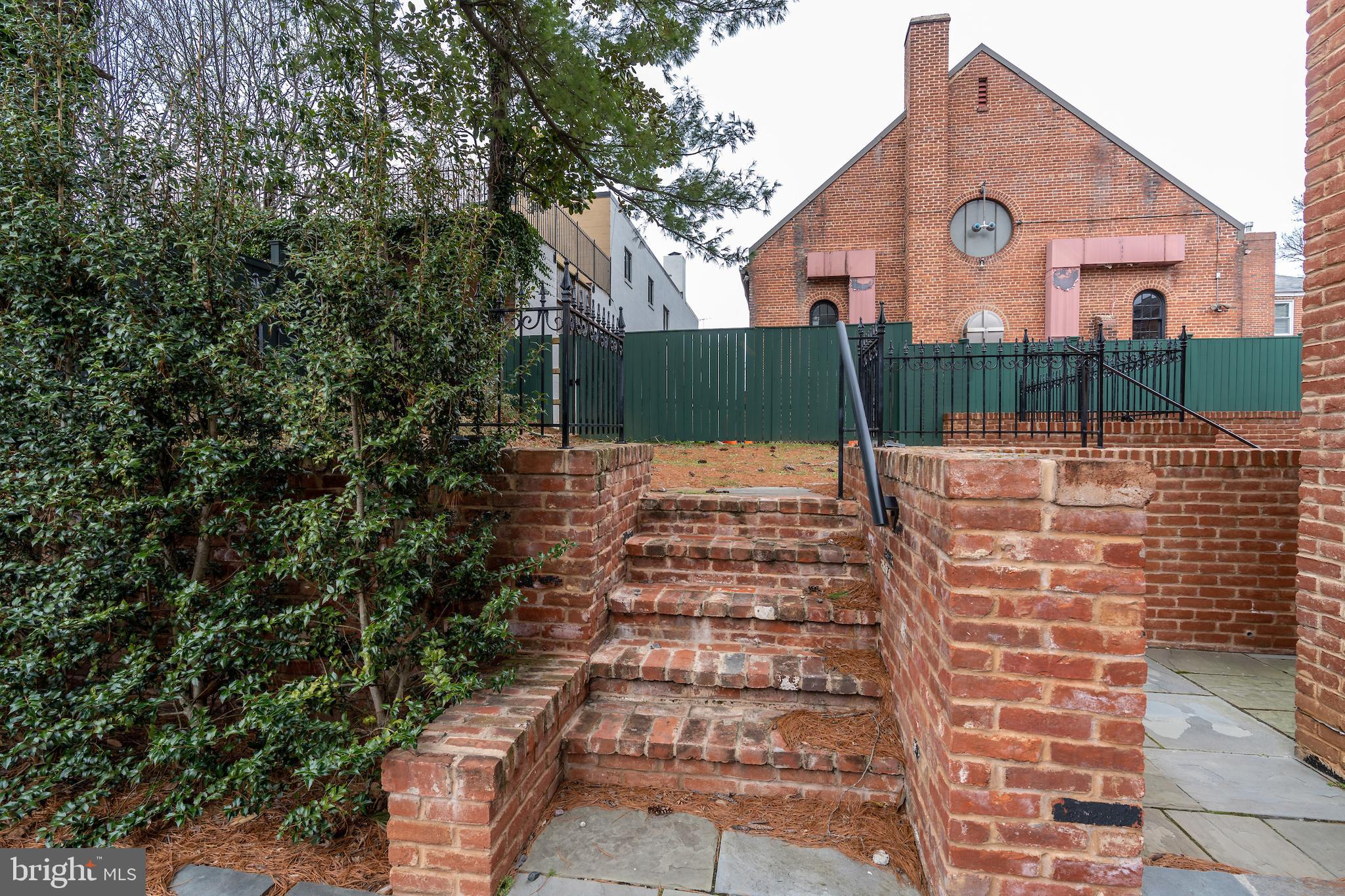 2715 N Street Northwest Washington, DC 20007 - Photo 7 of 41 a view of a yard with a house and a tree