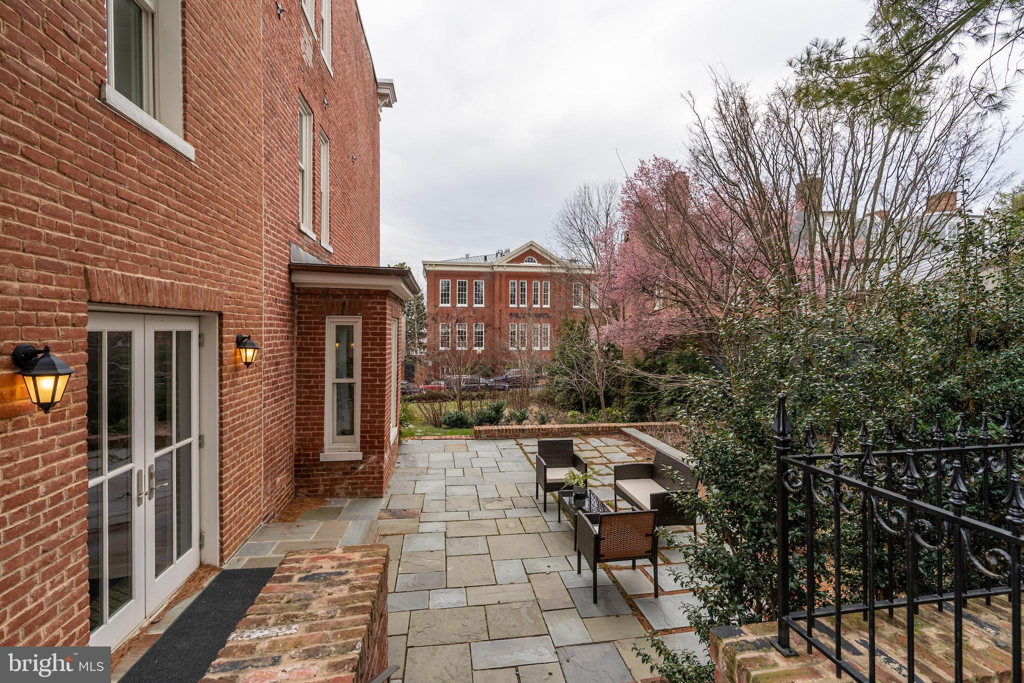 2715 N Street Northwest Washington, DC 20007 - Photo 9 of 41 a view of a brick house with many windows