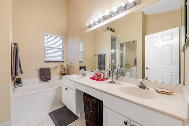 a bathroom with a sink double vanity and a mirror