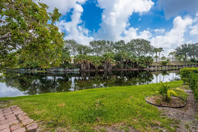 a view of a lake with a house in the background