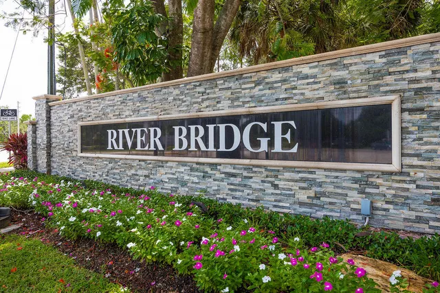a sign broad in front of flowers