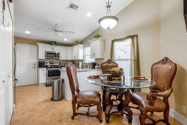 a dining room with furniture and window