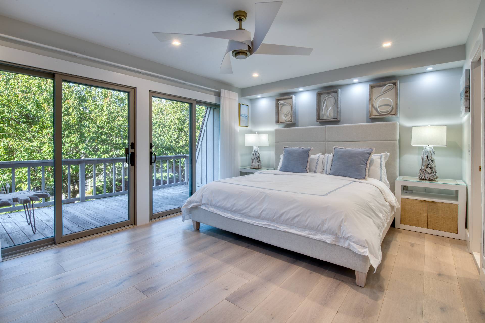 18 Bridge Street, Unit 2C Sag Harbor, NY 11963 - Photo 6 of 12 a bedroom with a large bed and a large window