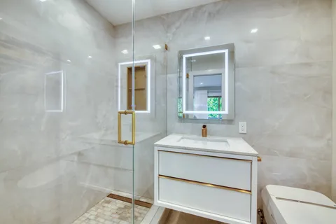 a bathroom with a sink and a mirror