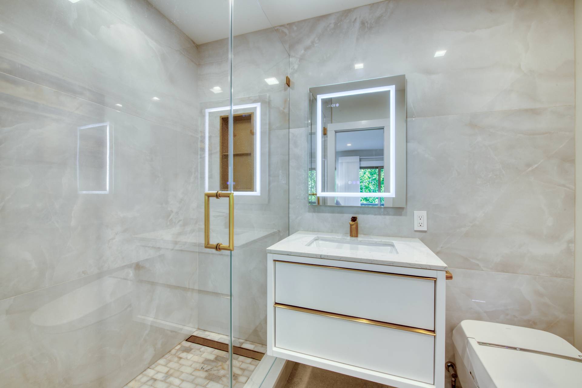 18 Bridge Street, Unit 2C Sag Harbor, NY 11963 - Photo 7 of 12 a bathroom with a sink and a mirror