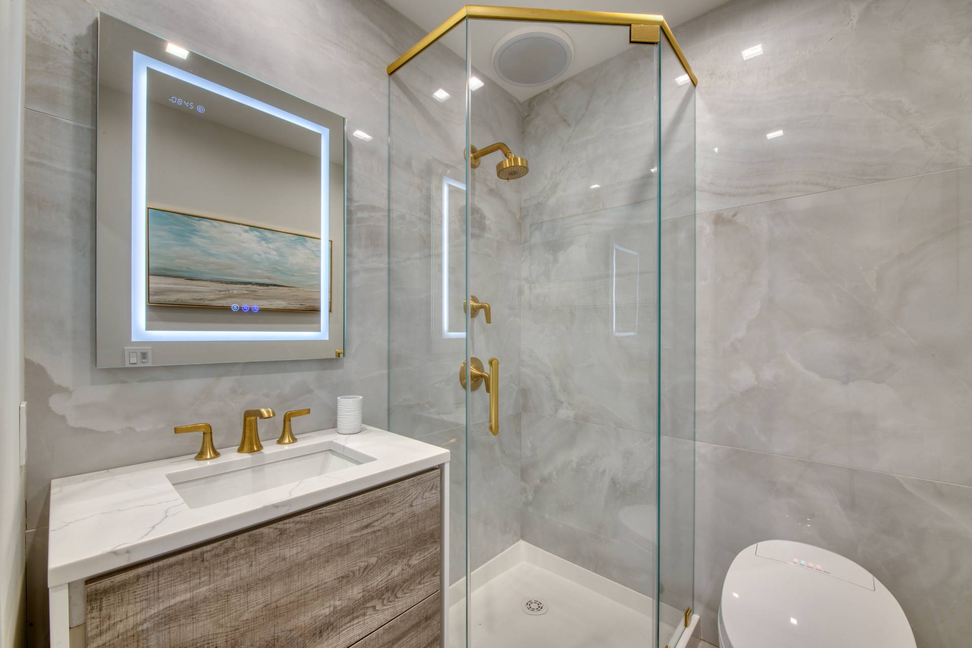 18 Bridge Street, Unit 2C Sag Harbor, NY 11963 - Photo 9 of 12 a bathroom with a granite countertop sink mirror and shower