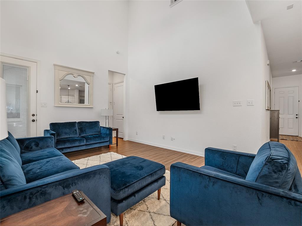 223 Woodson Street Irving, TX 75063 - Photo 15 of 40 a living room with furniture and a flat screen tv