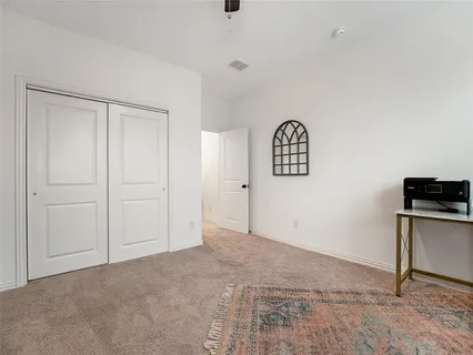 a bed room with a bed and a window