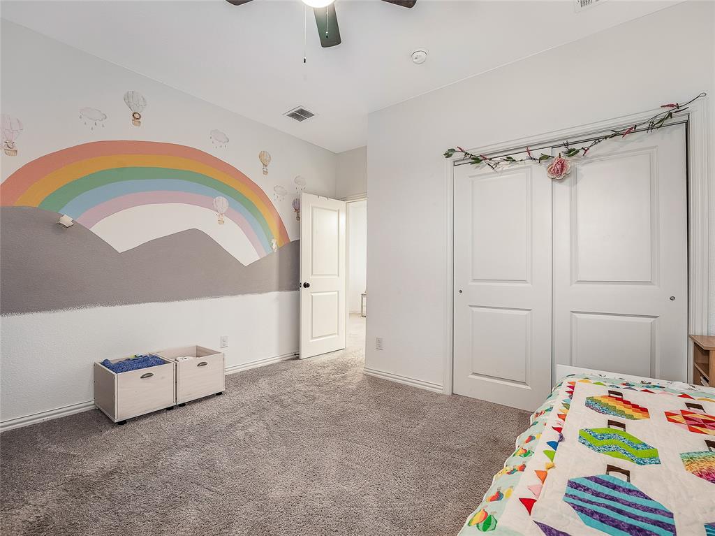 223 Woodson Street Irving, TX 75063 - Photo 30 of 40 a bedroom with a bed and a window