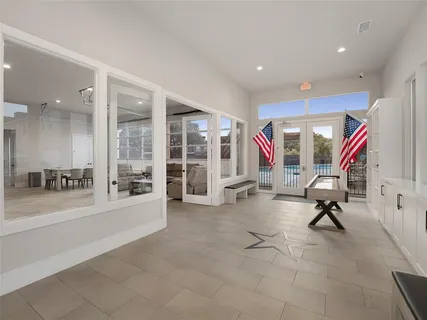 a room with gym equipment and a flat screen tv