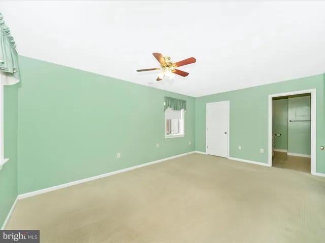 a bathroom with a granite countertop sink a mirror and a vanity