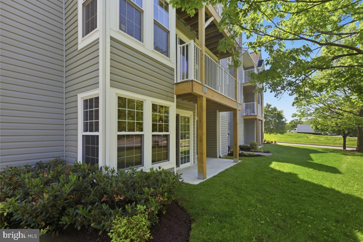 6470 Greenfield Road, Unit 1105 Elkridge, MD 21075 - Photo 16 of 18 Charming exterior with lush greenery.