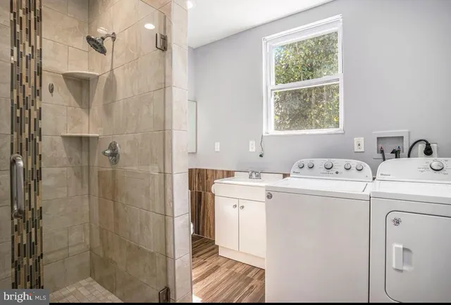 a bathroom with a sink and a shower