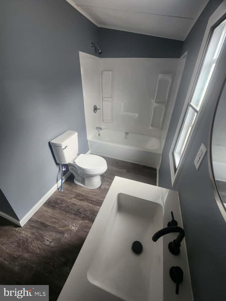 260 Marshall Mill Road, Unit 148 Franklinville, NJ 08322 - Photo 11 of 14 a bathroom with a sink and a toilet