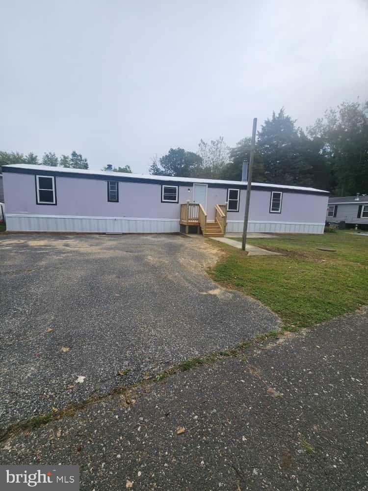 260 Marshall Mill Road, Unit 148 Franklinville, NJ 08322 - Photo 2 of 14 a view of a big yard with a house